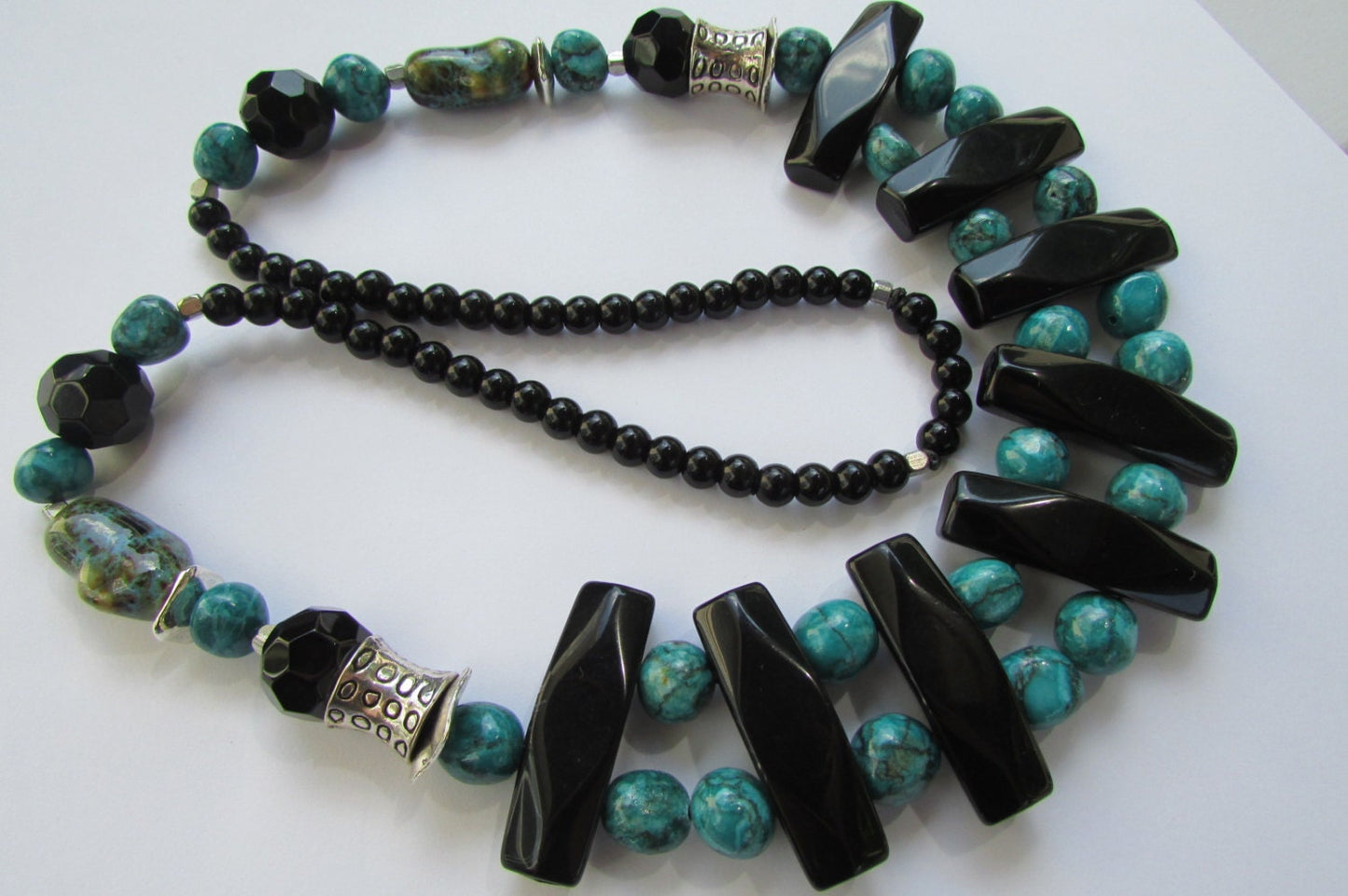 Mixed material beaded necklace - porcelain, metal, plastic, glass - shades of turquoise & black