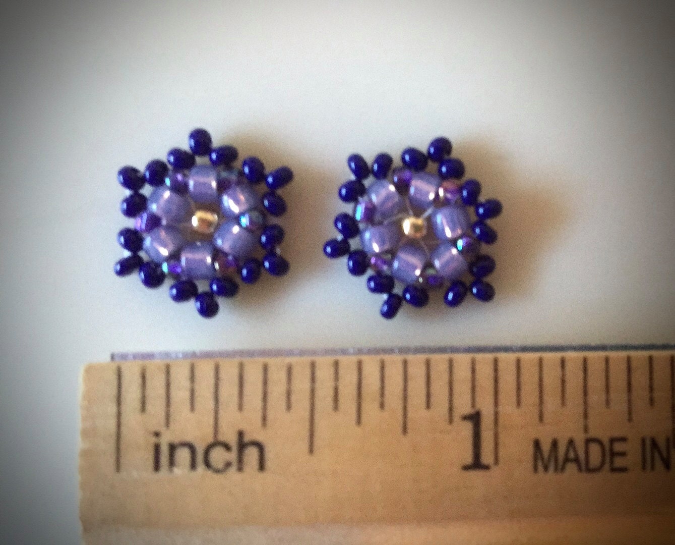 Tiny little hand beaded stud earrings - shades of purple and dark navy blue with goldtone center