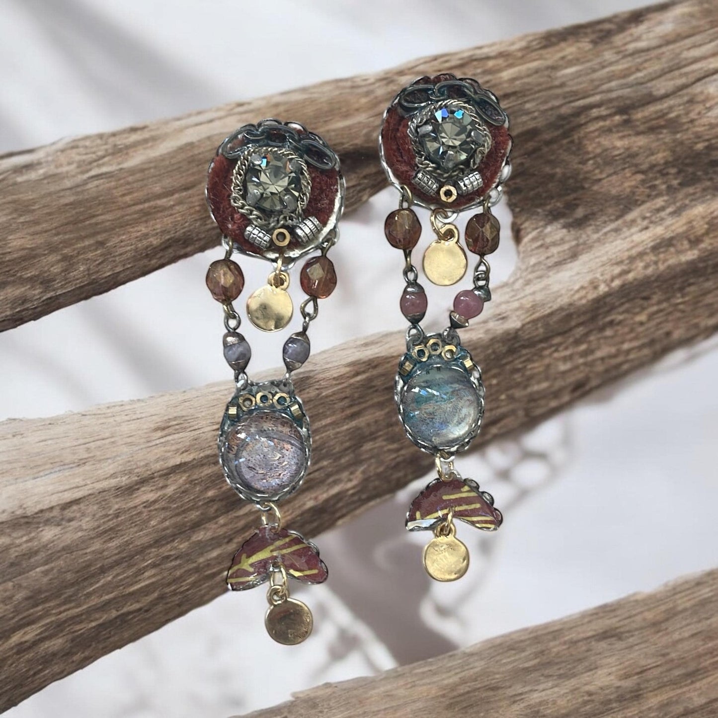 One-of-a-kind earrings made with, paper, fabric, velvet, rhinestones, chain, mixed metals and postage stamp remnants. Sterling ear wires.