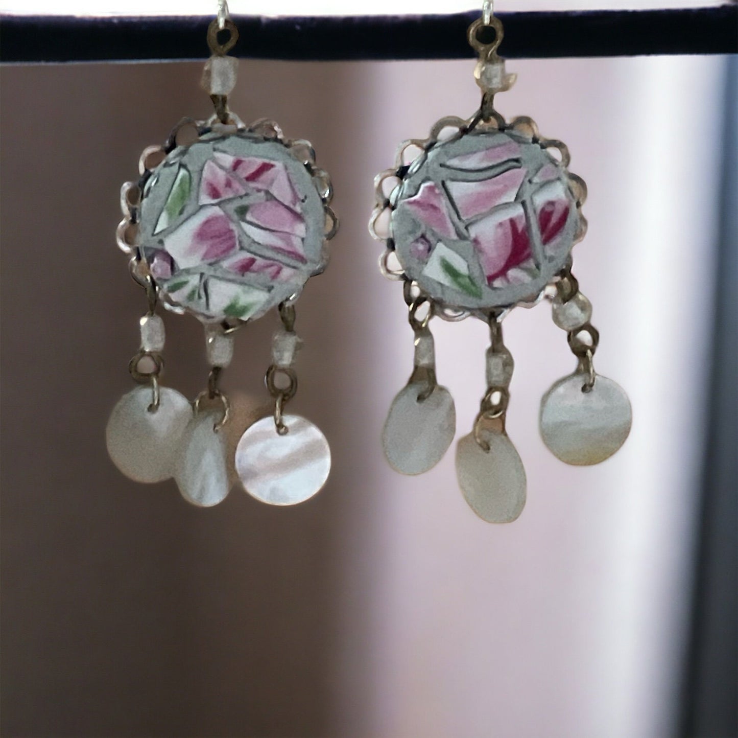 Unique earrings made of hand cut mosaic tile from vintage plates combined with mother of pearl dangles