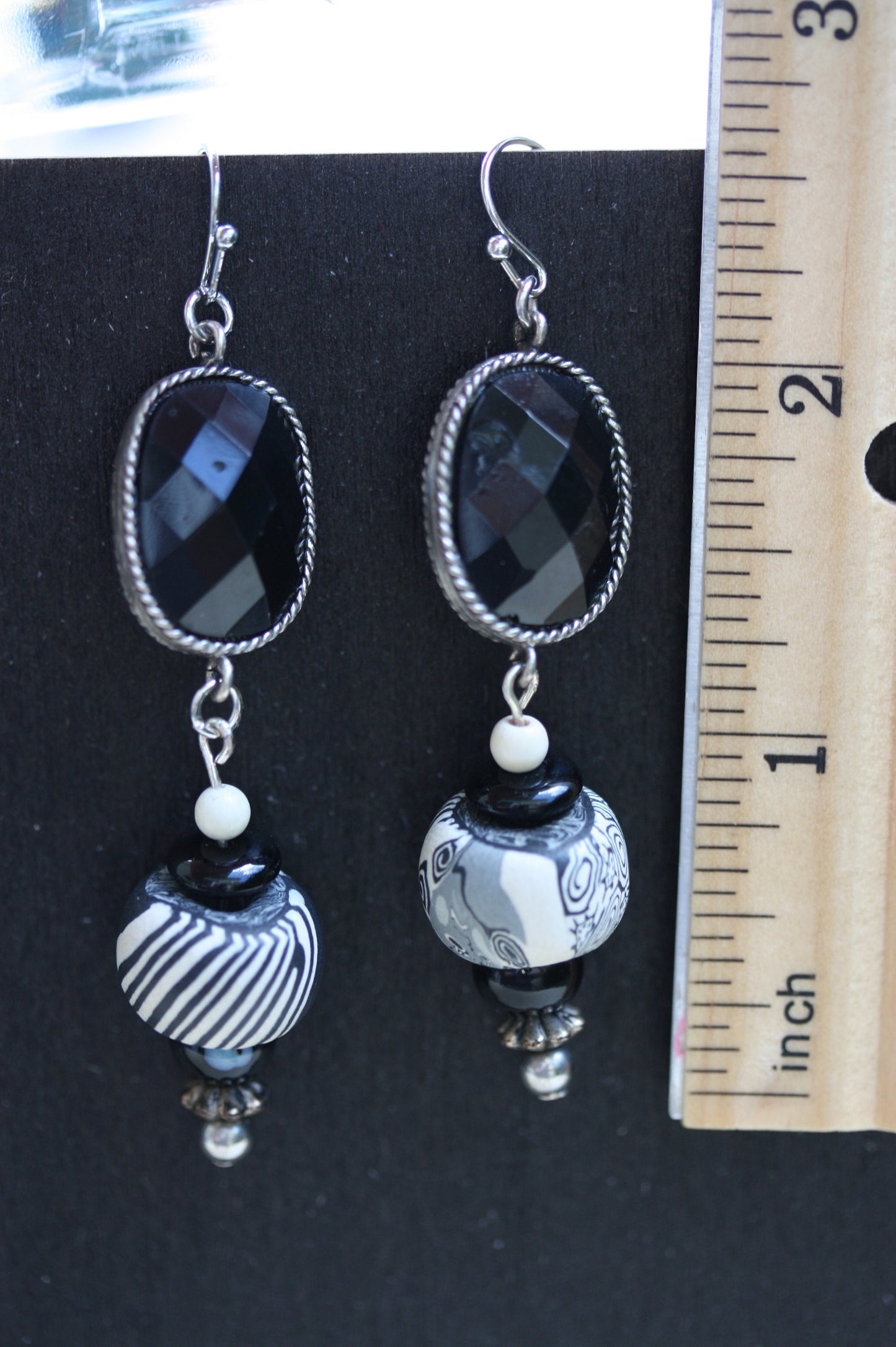 Black and white mixed media earrings made of upcycled polymer clay, combined with vintage black faux crystal, metal and glass spacer beads