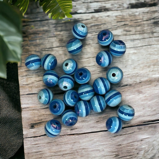 One dozen striped shades of blue vintage beads - approx. 6 mm each