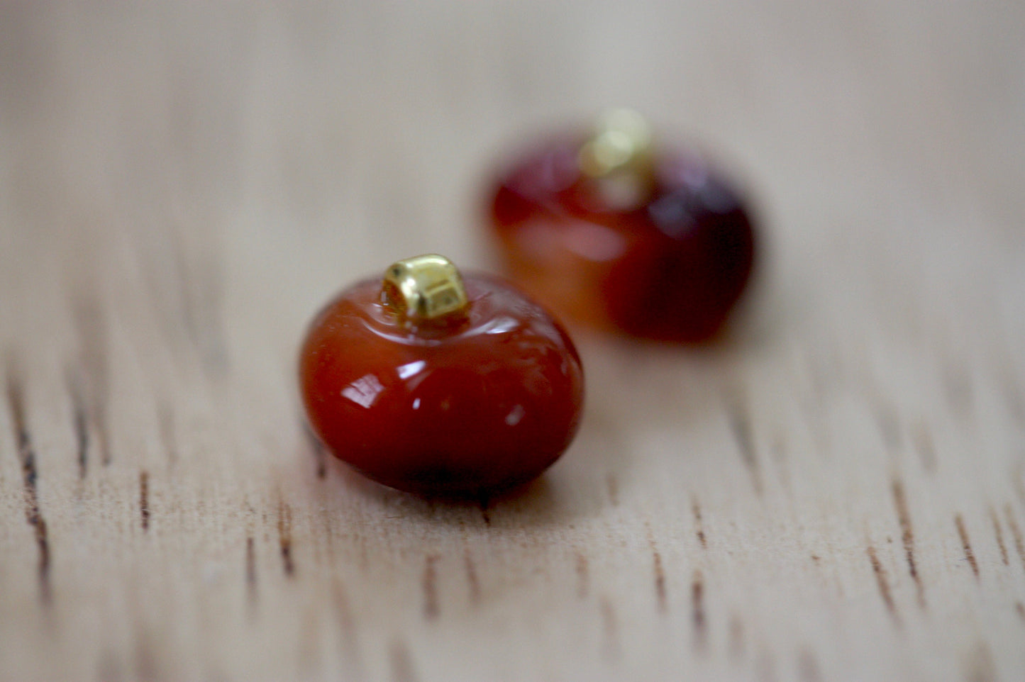 Small little orange glass stud earrings
