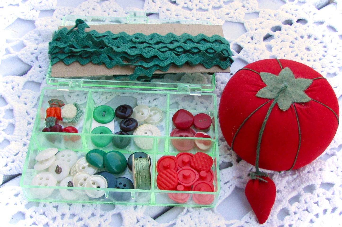 Vintage sewing inspiration box - filled with vintage buttons and sewing supplies shown - vegetable theme - in the shades of red and green