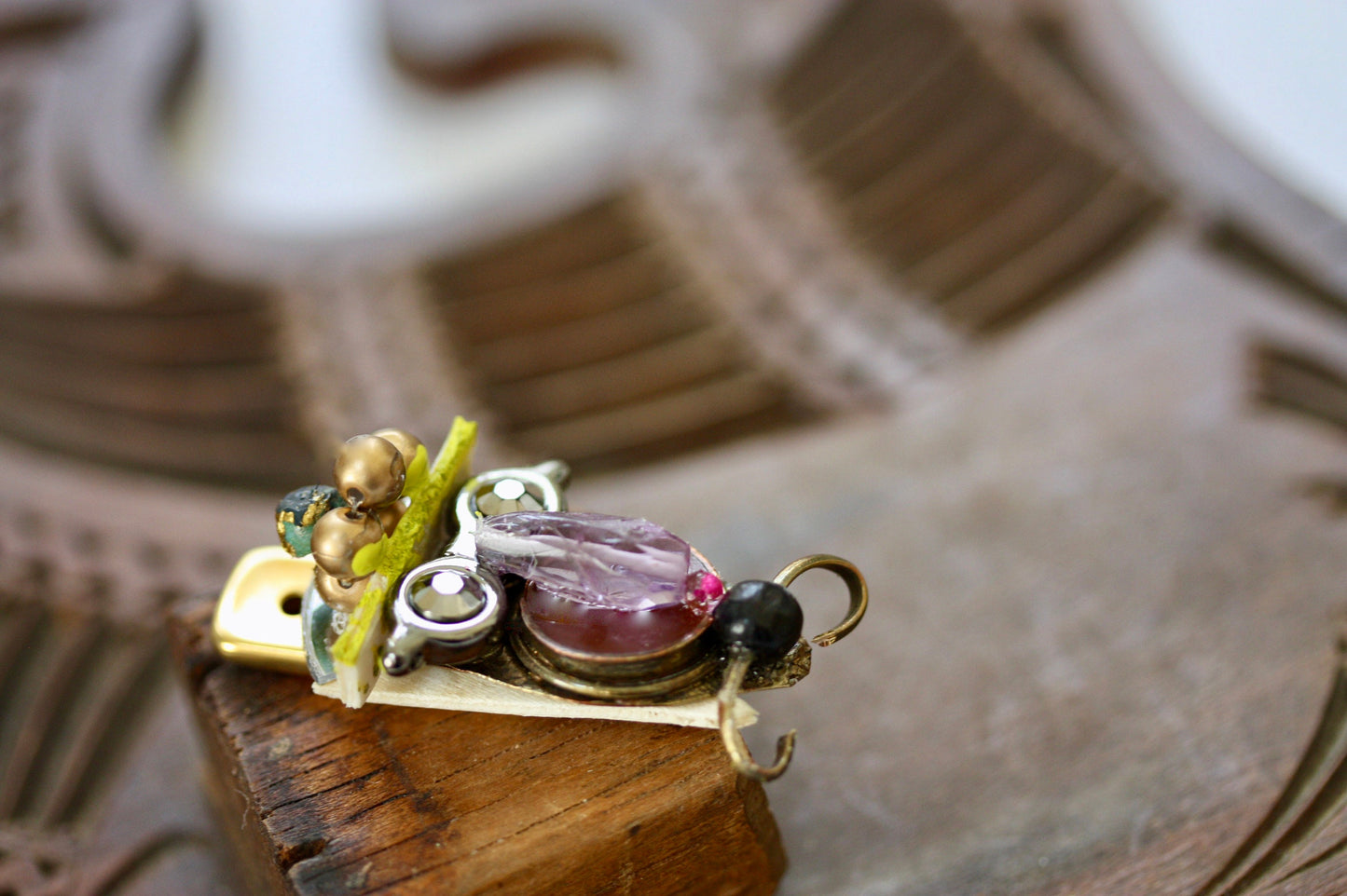 Meet "Henrietta."  Henrietta is a really cool assemblage art gal who can be transformed into a necklace, pin, magnet, bottle or little dish