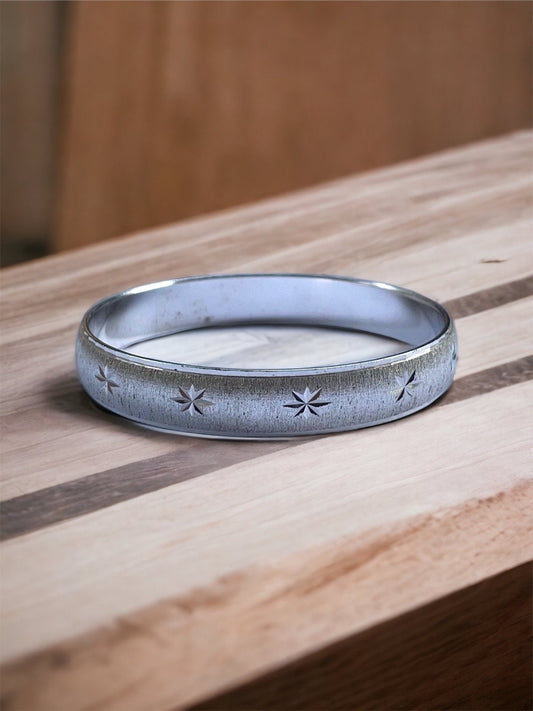 Vintage silvertone bangle bracelet with etched stars