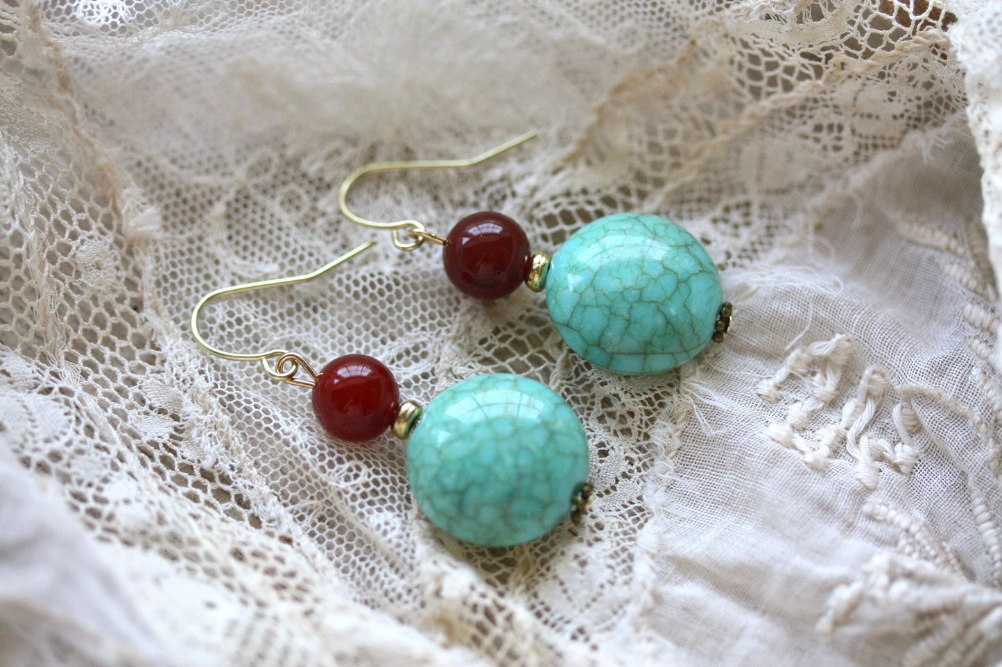 Dangle earrings made of faux turquoise and deep red glass