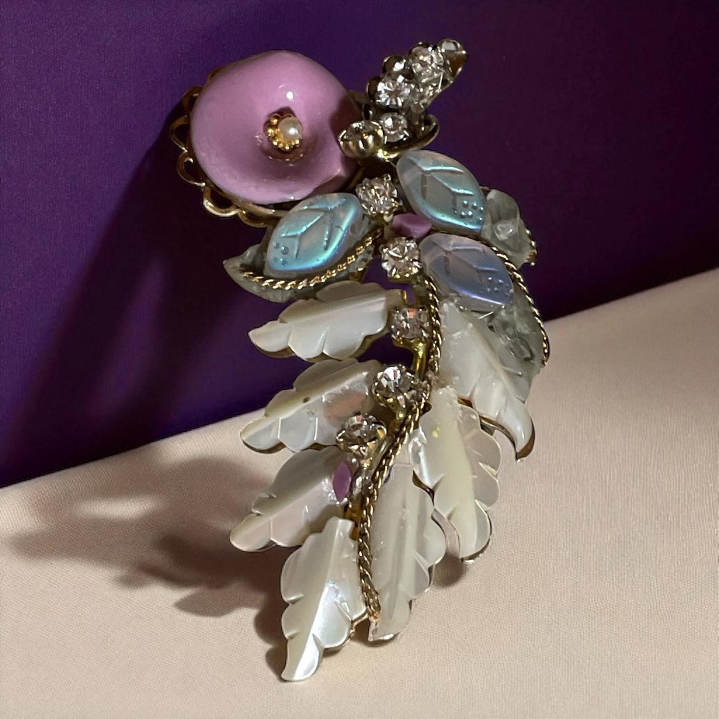 Unique mixed material brooch pin - pink enameled flower with faux pearl center, mother of pearl & white iridescent glass leaves, rhinestones