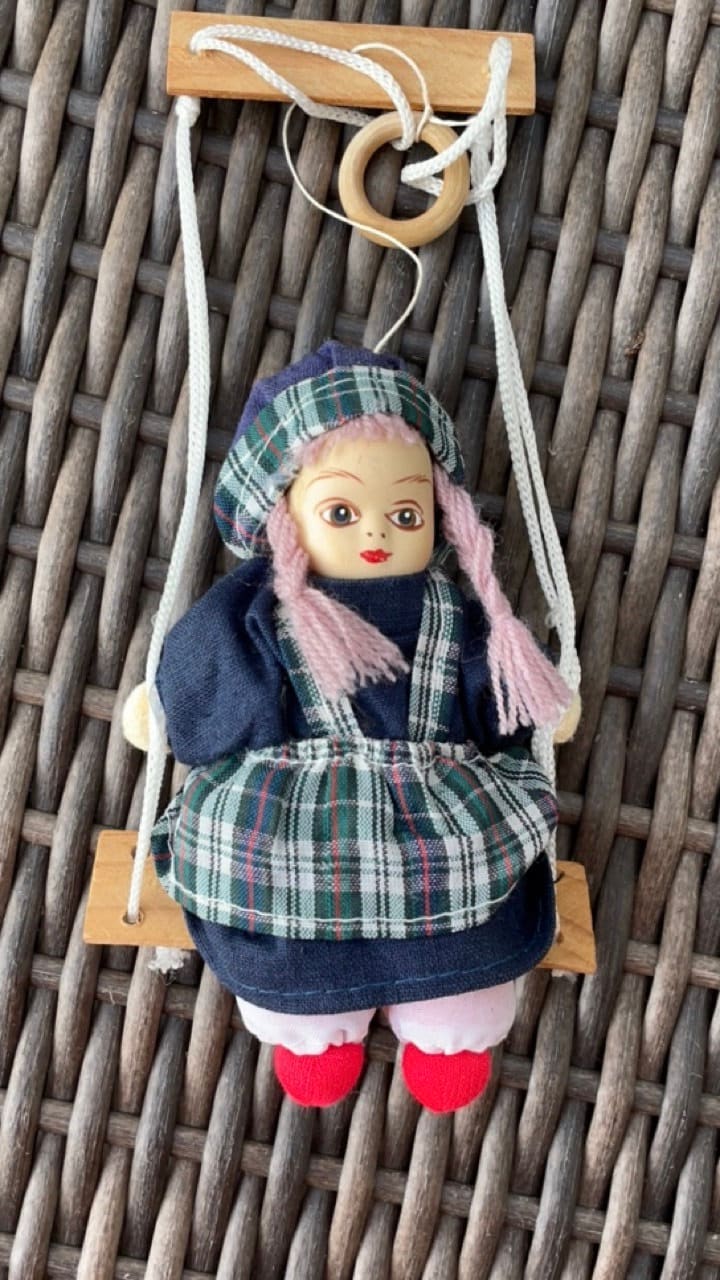 Little porcelain girl doll on swing dangling figurine by Lidco