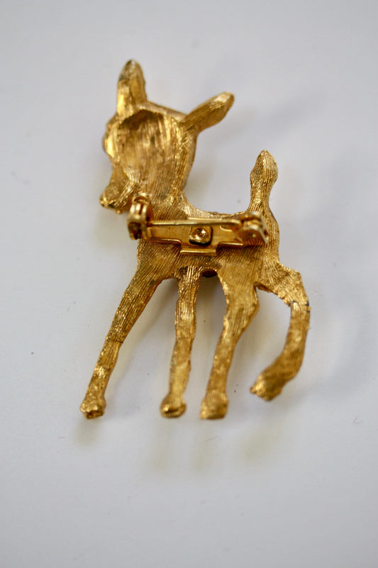 Charming vintage reindeer pin loaded with rhinestones