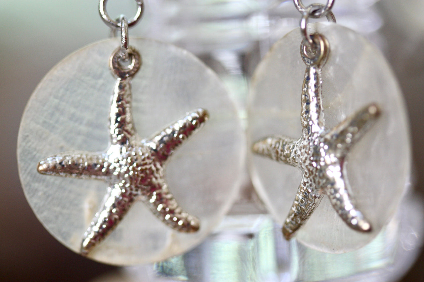 Capiz shell, faux pearl and silvertone starfish beach themed dangle earrings