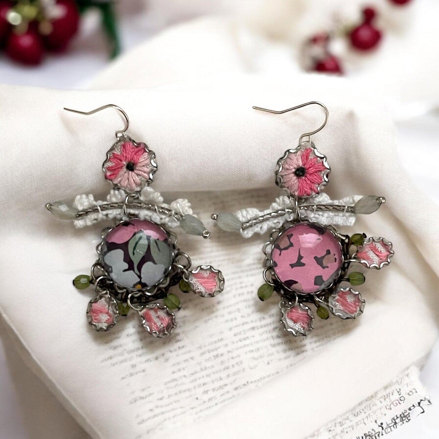 Mixed media earrings made with vintage crochet lace, embroidery from a vintage linen table runner, paper, satiny ribbon and mixed metals