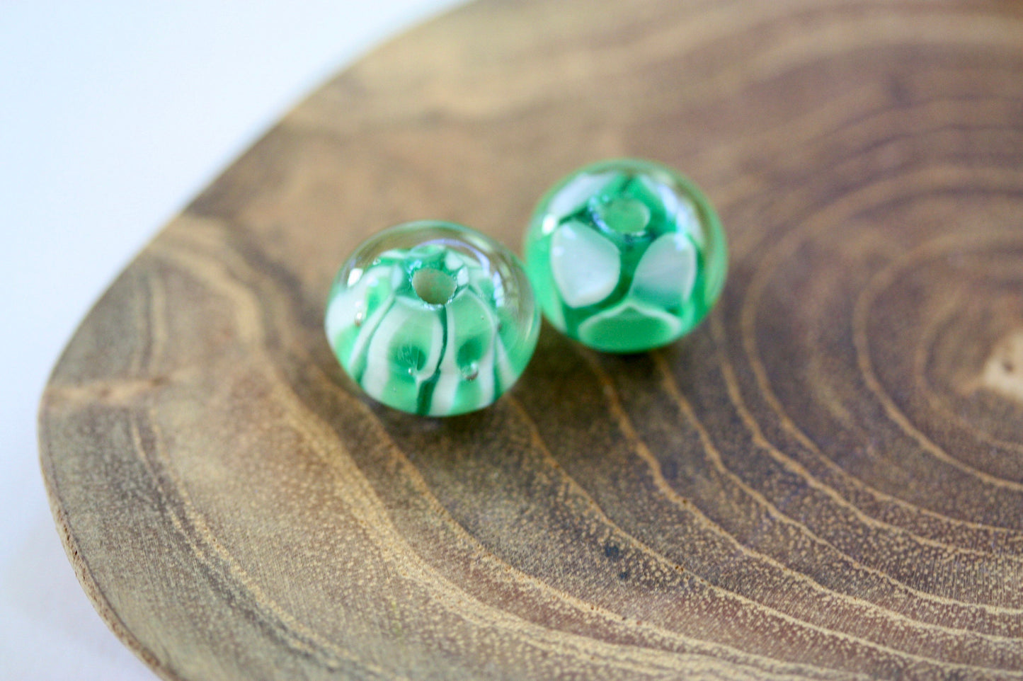 Two stunning vintage glass beads - shades of green and white