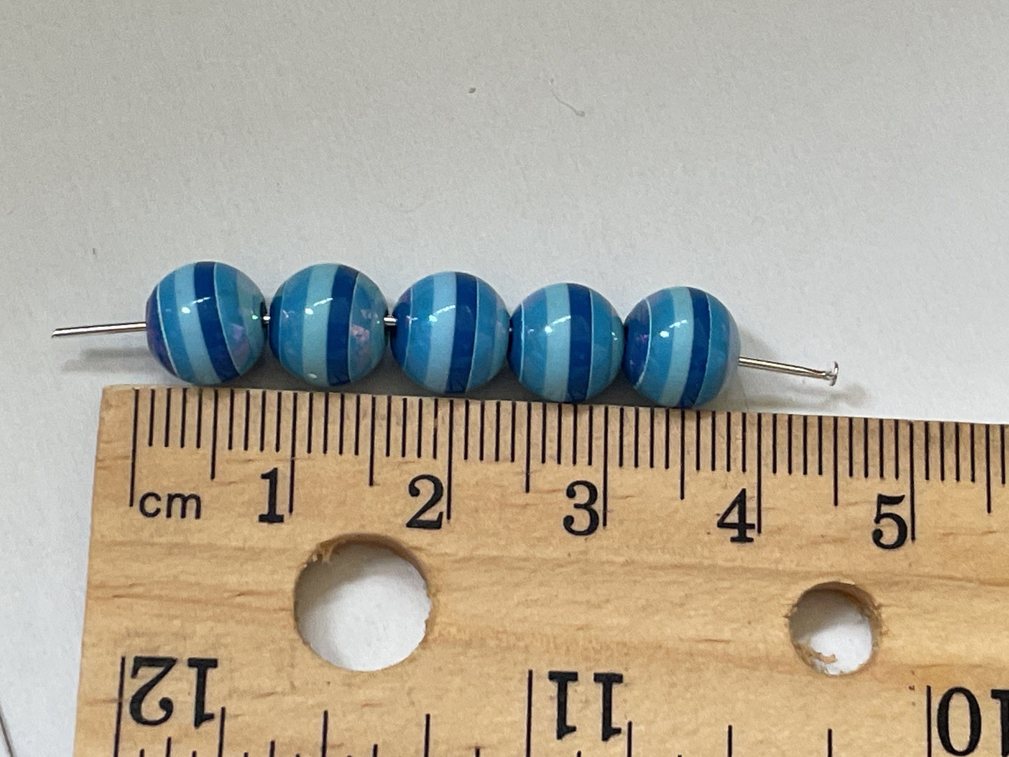 One dozen striped shades of blue vintage beads - approx. 6 mm each