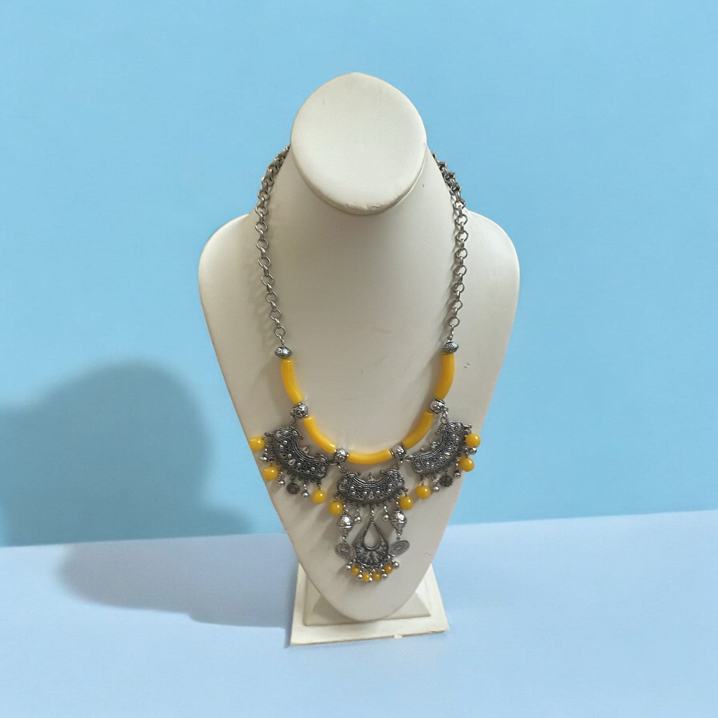 Exotic Indian style necklace with yellow beaded balls/tubes and ornate silver trim