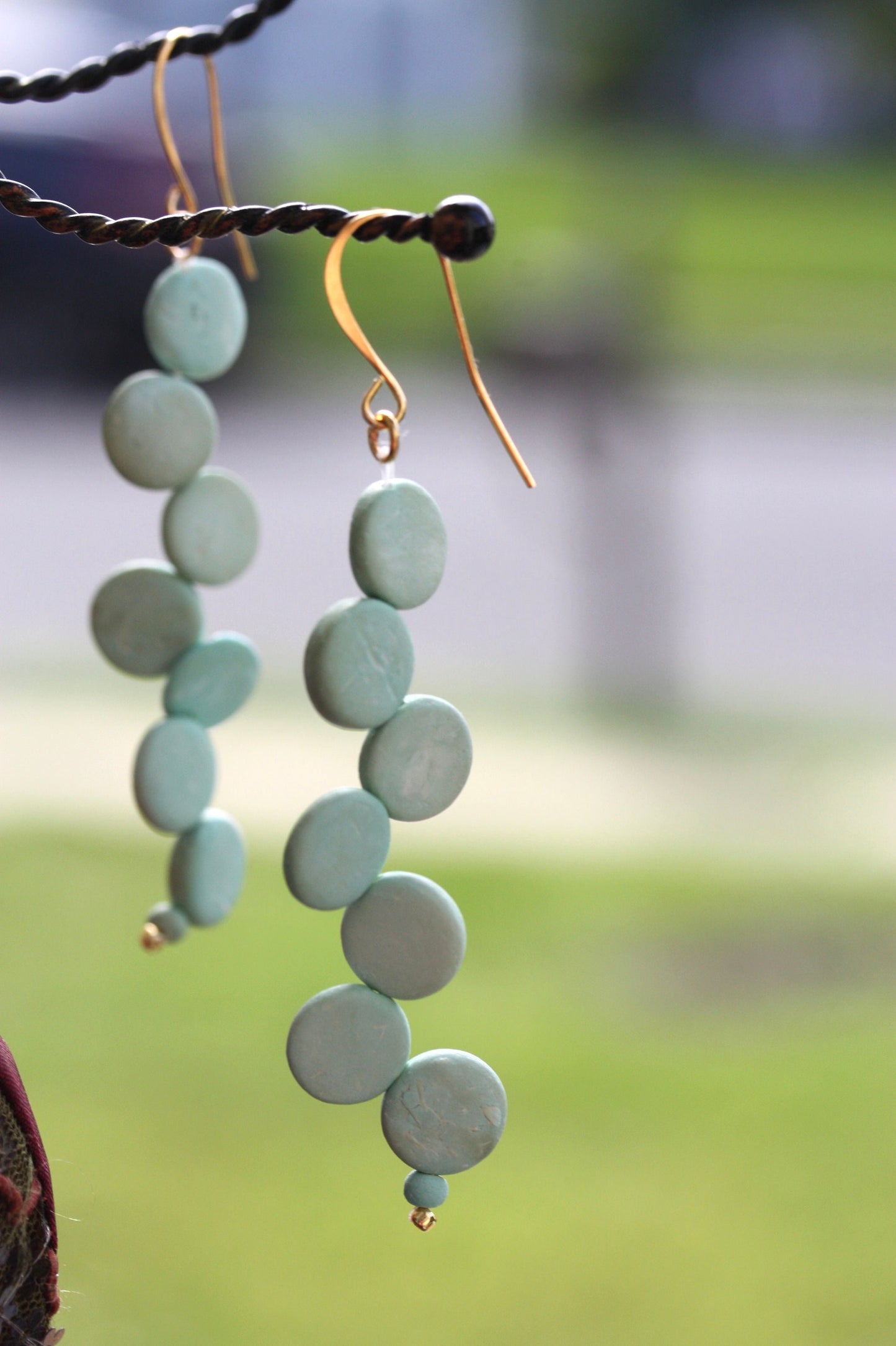 Handsewn aqua tinted wooden disk Scandinavian-inspired earrings - with sloped goldstone ear wires