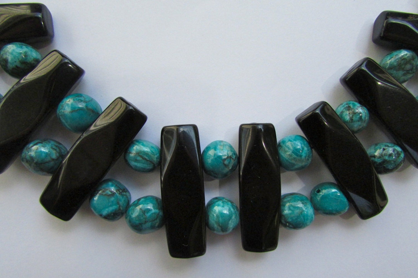 Mixed material beaded necklace - porcelain, metal, plastic, glass - shades of turquoise & black