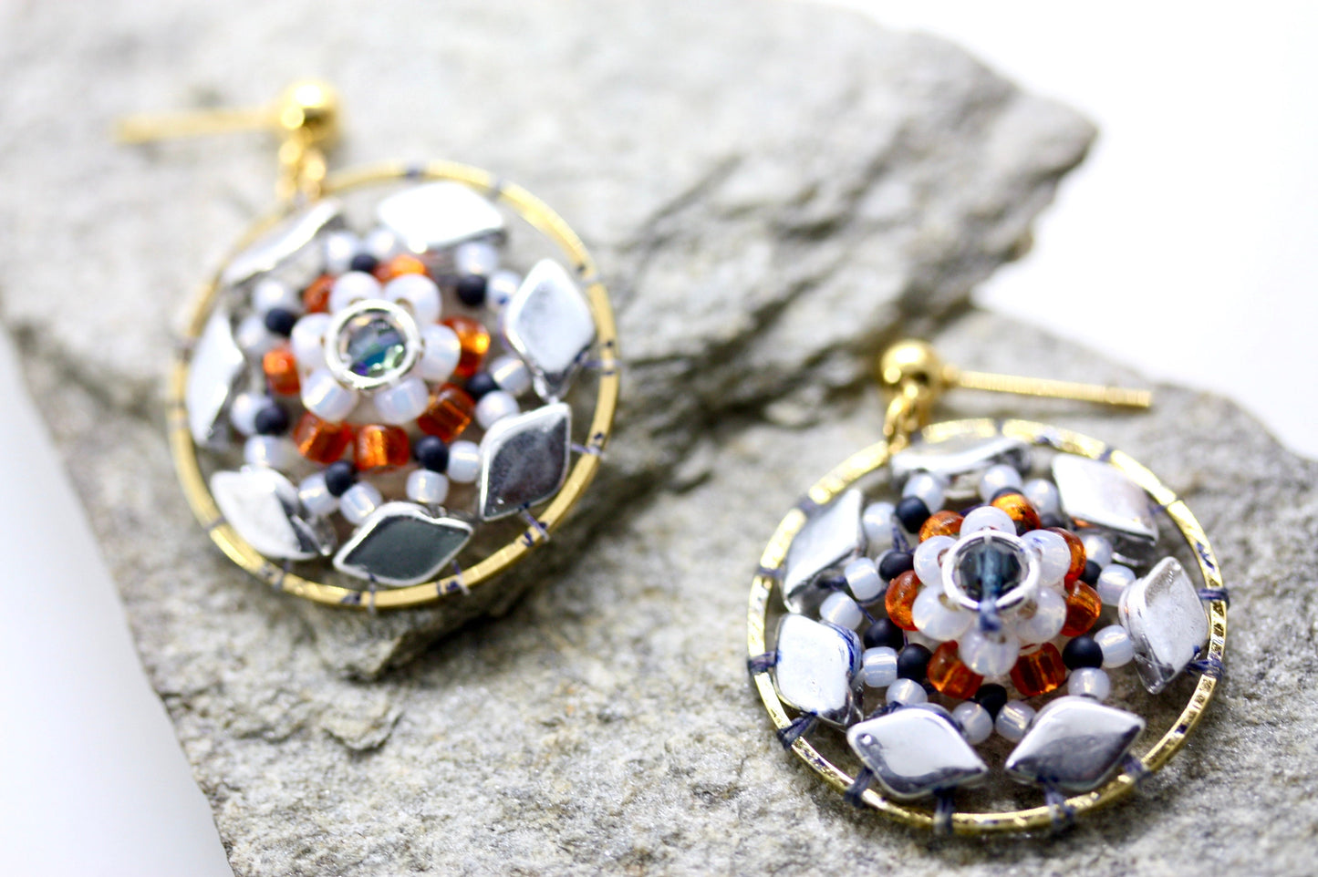 Orange and navy blue intricate beadwork small circular dangle earrings