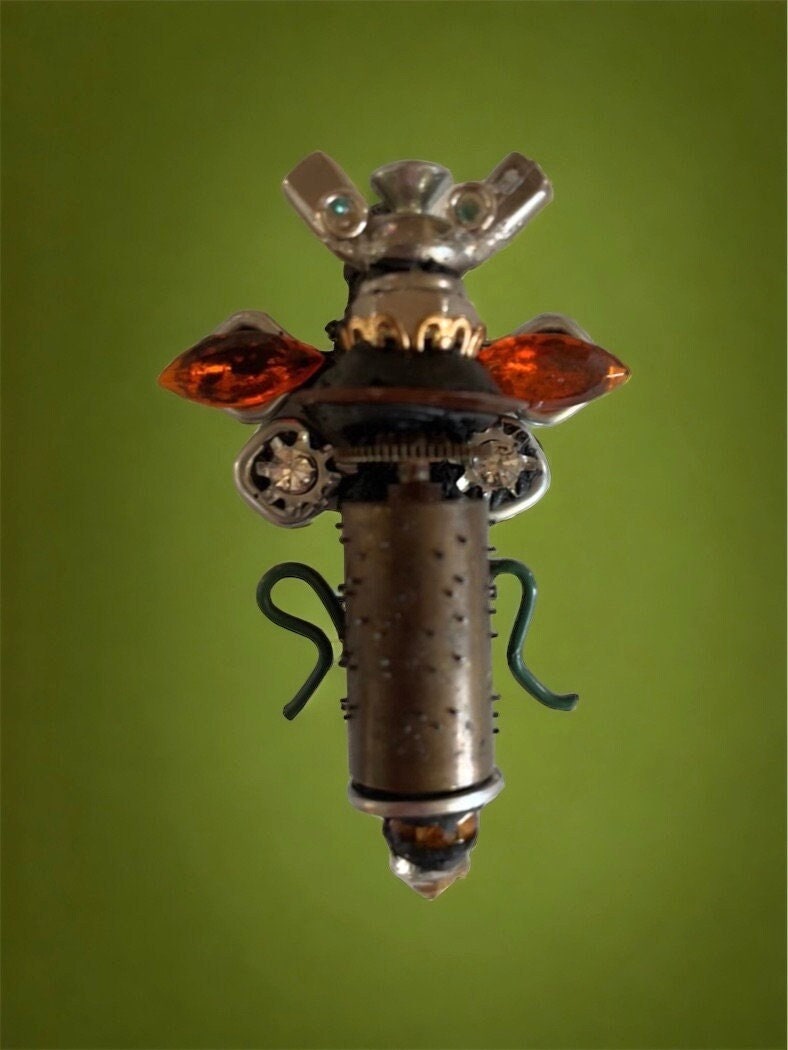Meet "Scout" , a mixed material insect made of parts of a vintage Swiss music box, along with nails, screws, bolts - pin or necklace pendant