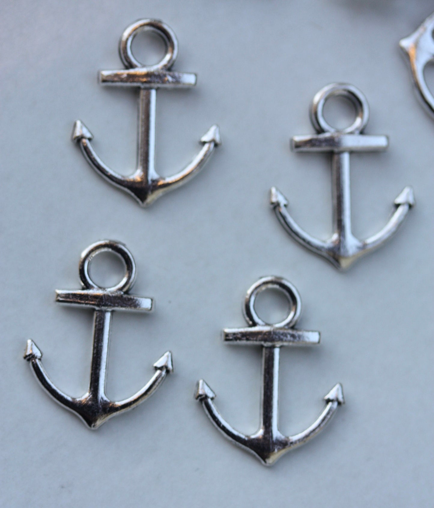 4 vintage boat anchor charms