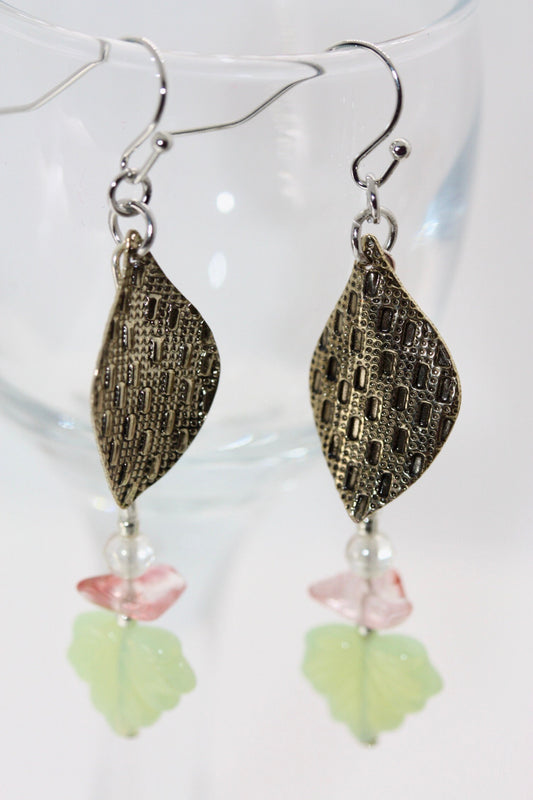 Handmade dangle earrings made of vintage textured metal leaves, pink gemstone chips and light green opaline glass ginko flower leaves