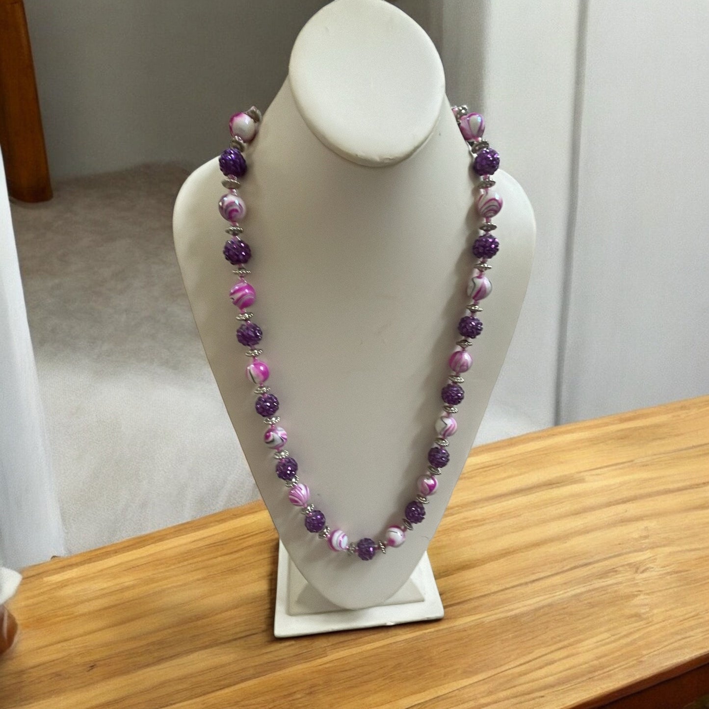 Shades of pinkish purple swirled vintage necklace with purple rhinestone beaded balls