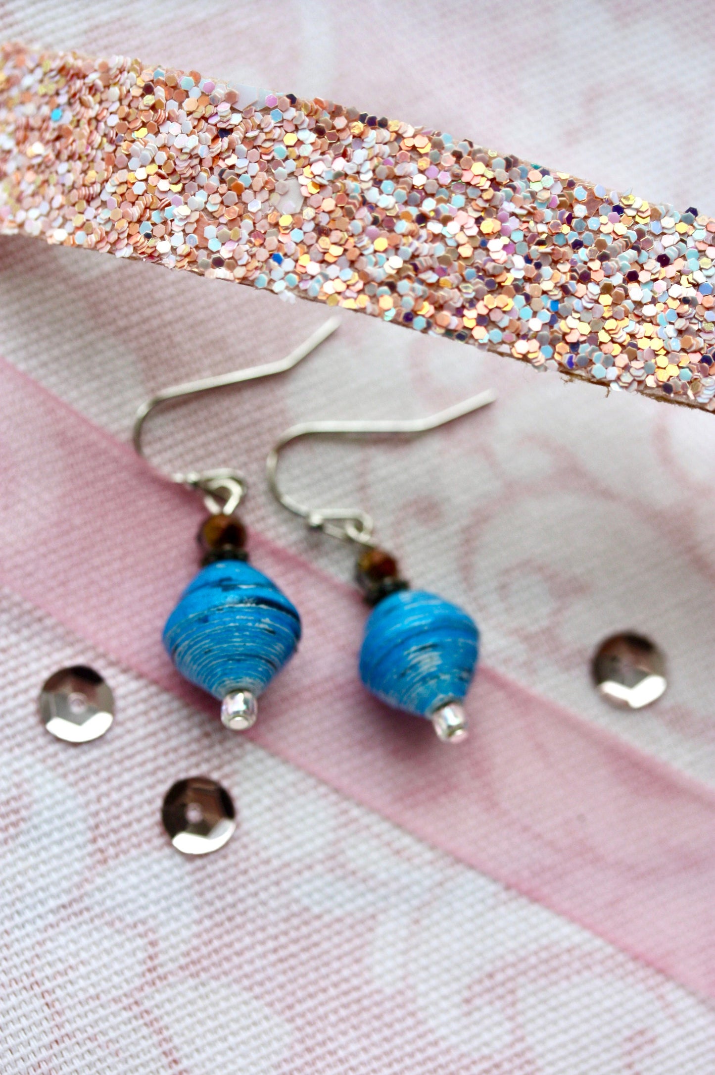Little dangle earrings made with blue rolled paper, crystal and white sparkly glass beads