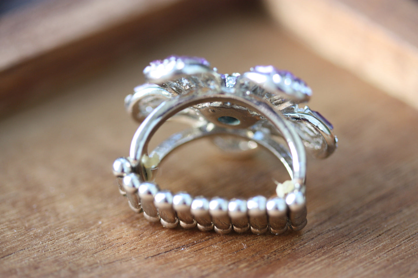 Stunning and unique vintage clear rhinestones and purple baguettes flower ring