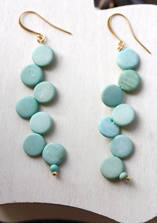 Handsewn aqua tinted wooden disk Scandinavian-inspired earrings - with sloped goldstone ear wires