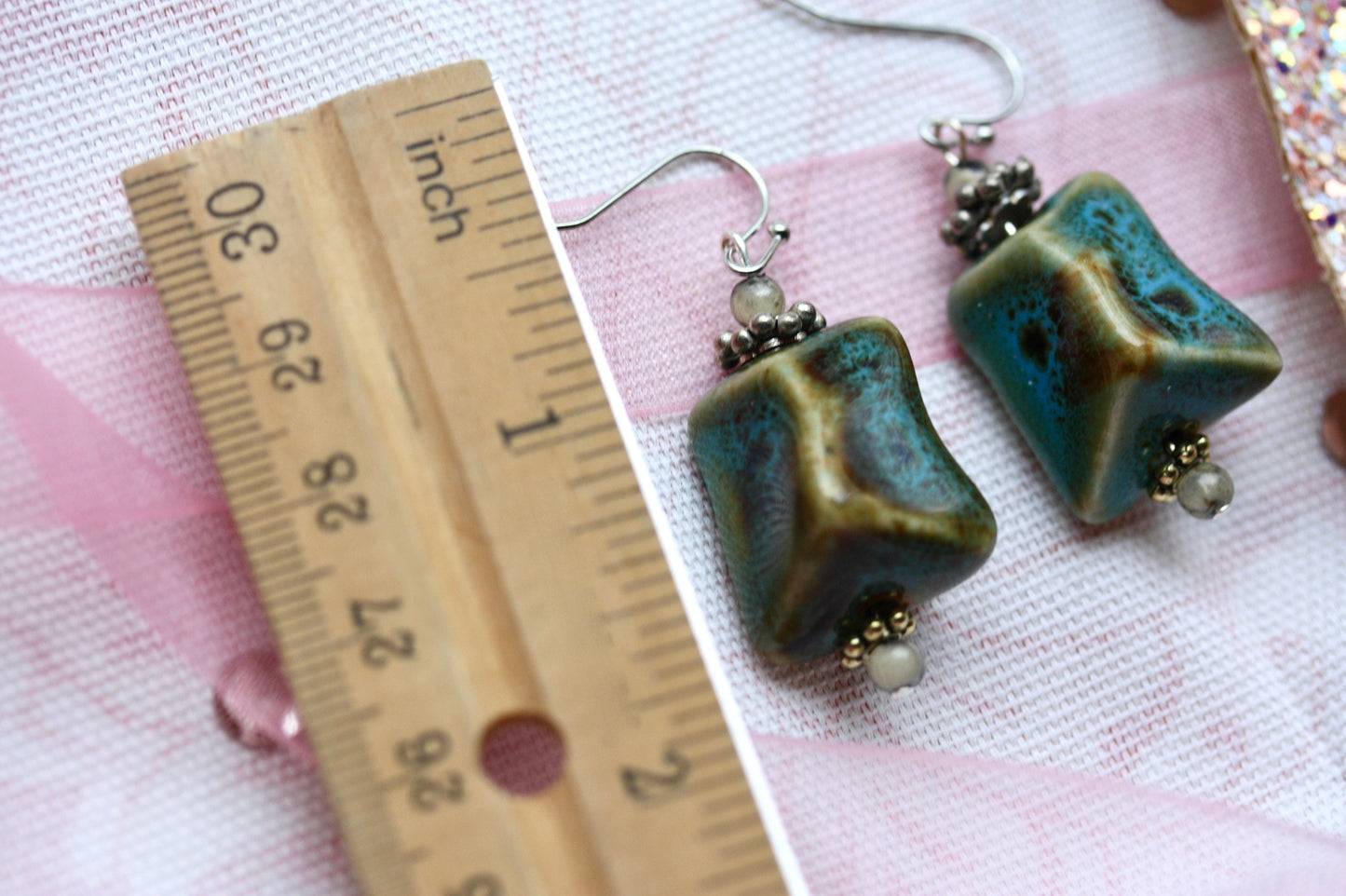 Handmade dangle earrings made with uniquely shaped faux turquoise beads