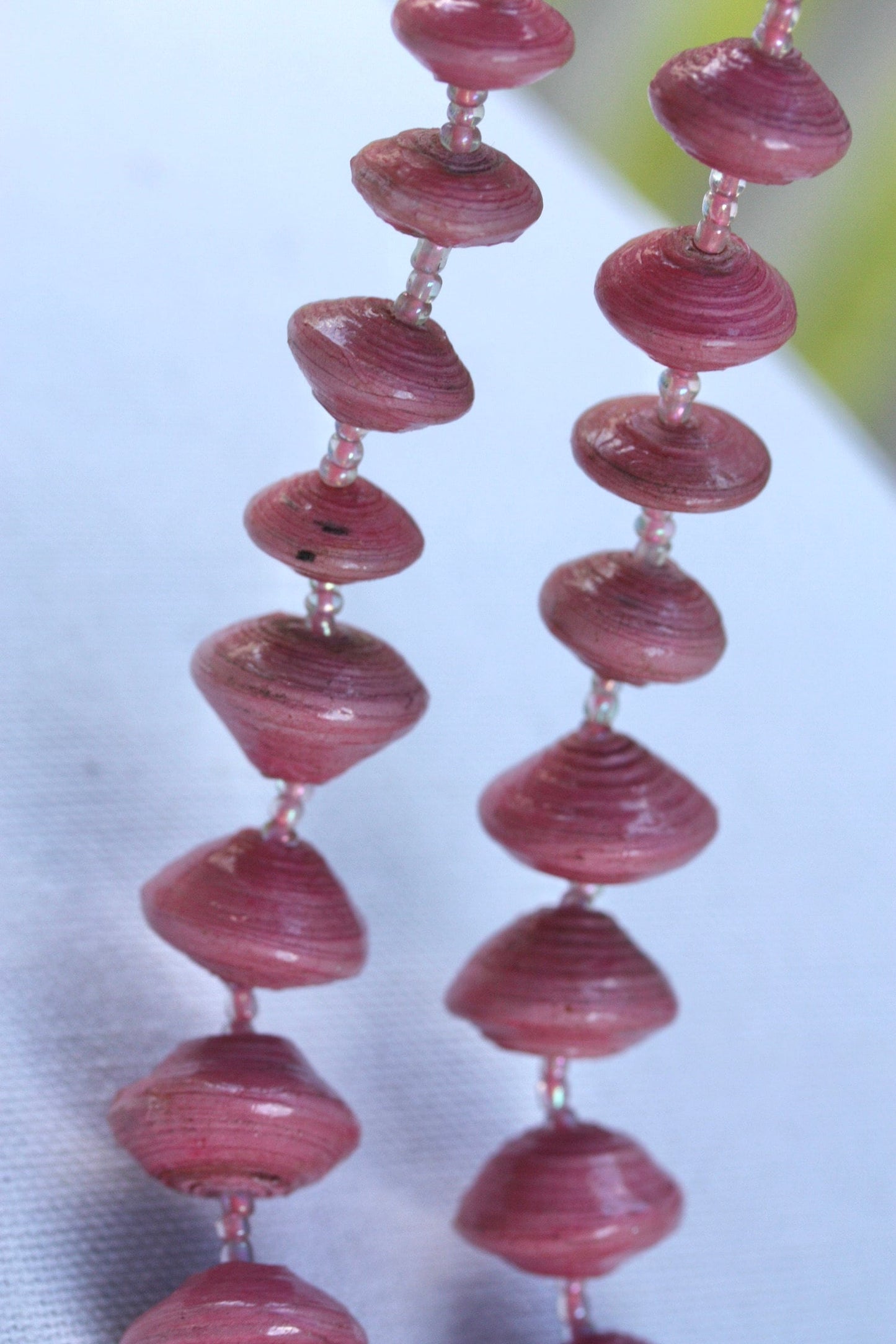 Long vintage various sized rolled paper light pink necklace