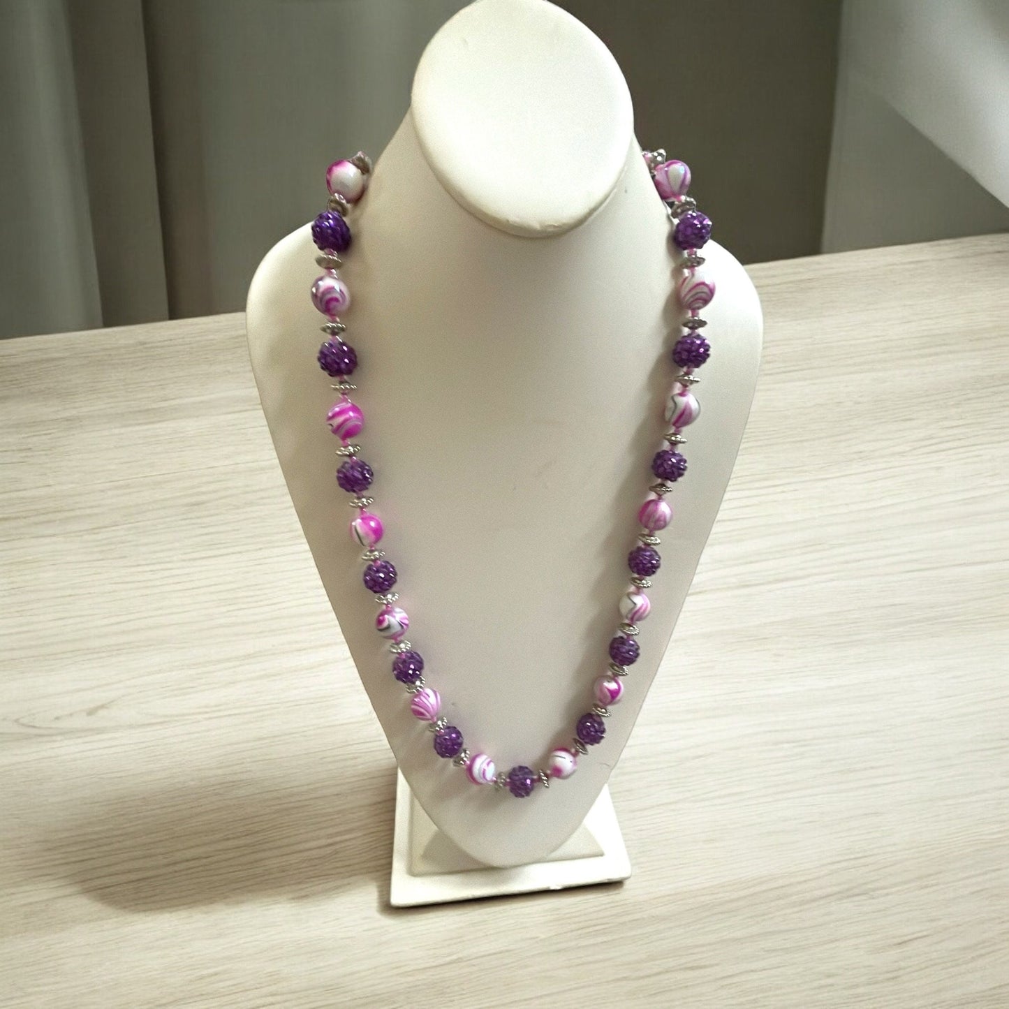 Shades of pinkish purple swirled vintage necklace with purple rhinestone beaded balls