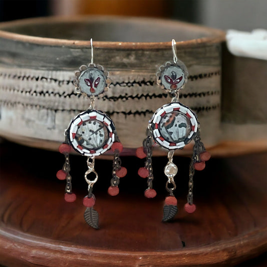 Hand cut micro mosaic millefiori glass dangle earrings surrounding butterfly wing image with orange wood dangles and feather charms