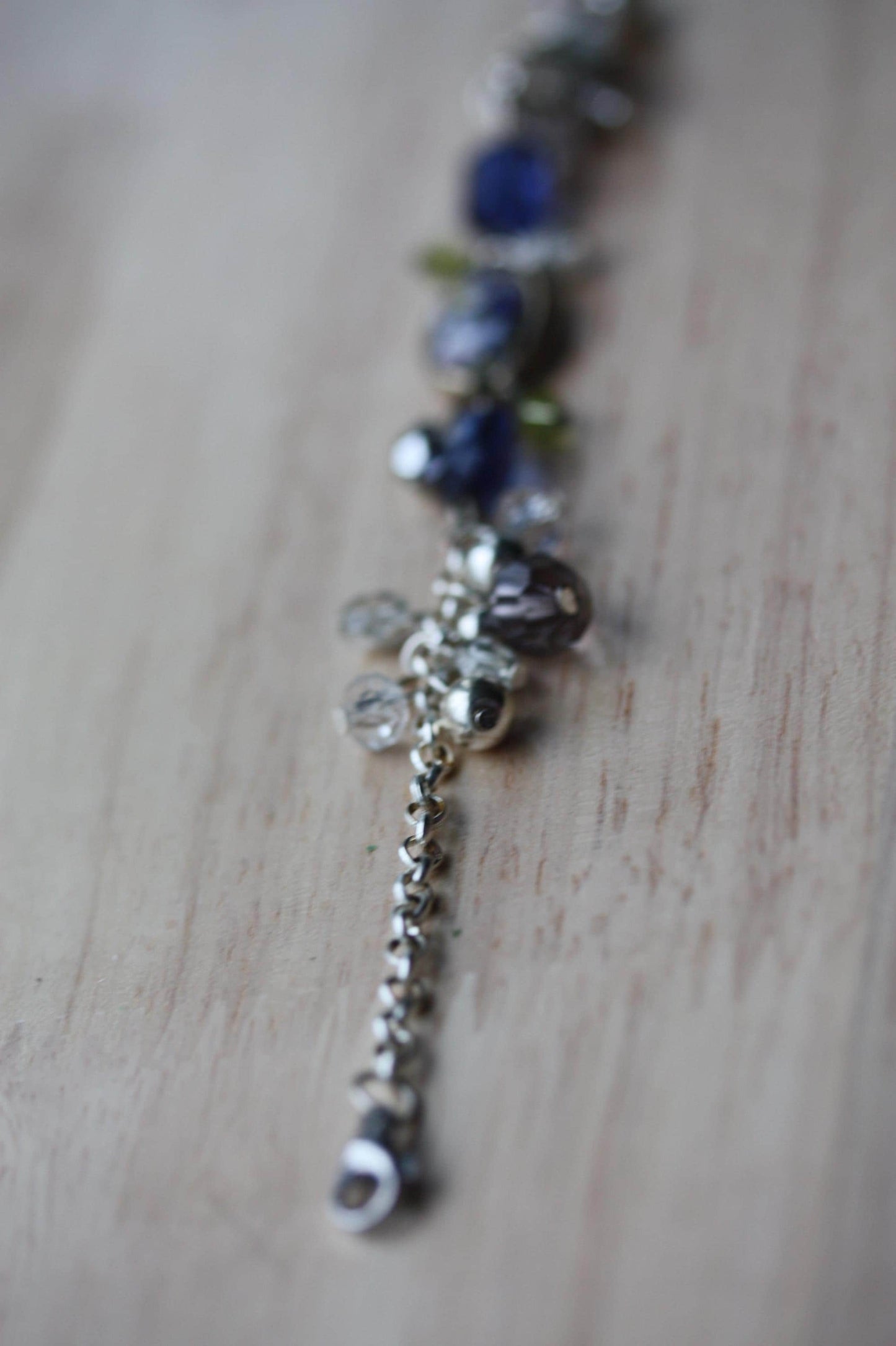 Handmade bracelet featuring a unique vintage art glass cabochon, royal blue faux crystals, yellow, pearl and clear crystal dangles - 7"