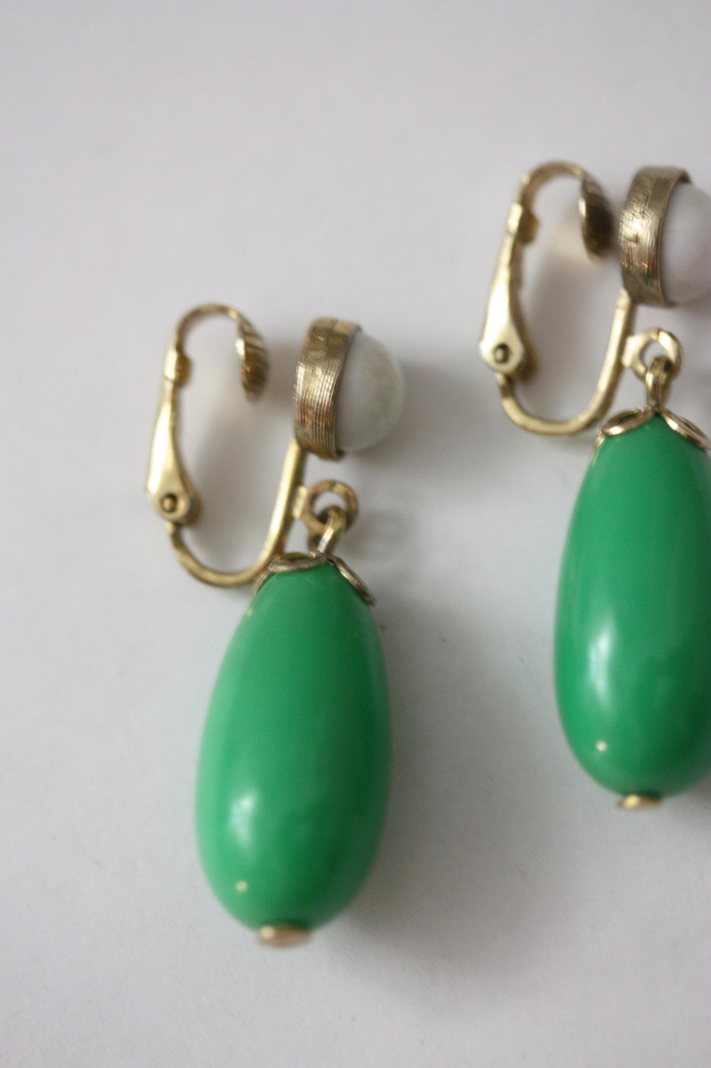 Green and white vintage Avon clip on dangle earrings