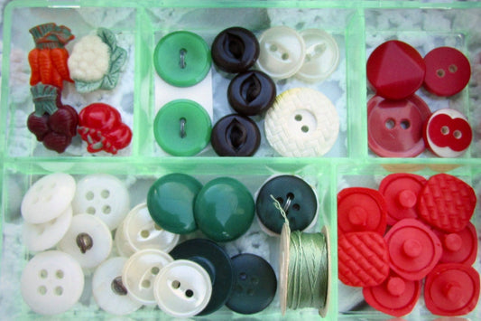 Vintage sewing inspiration box - filled with vintage buttons and sewing supplies shown - vegetable theme - in the shades of red and green