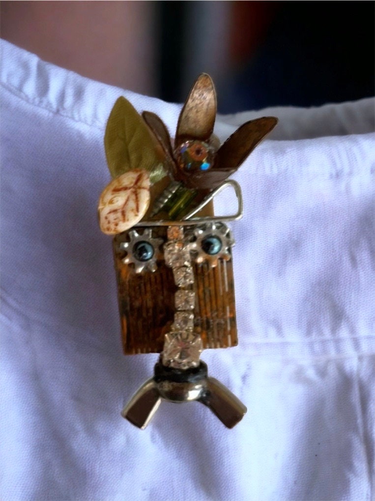 Meet "Gert" a mixed material piece made of parts of a vintage Swiss music box, along with hardware - pin or necklace pendant
