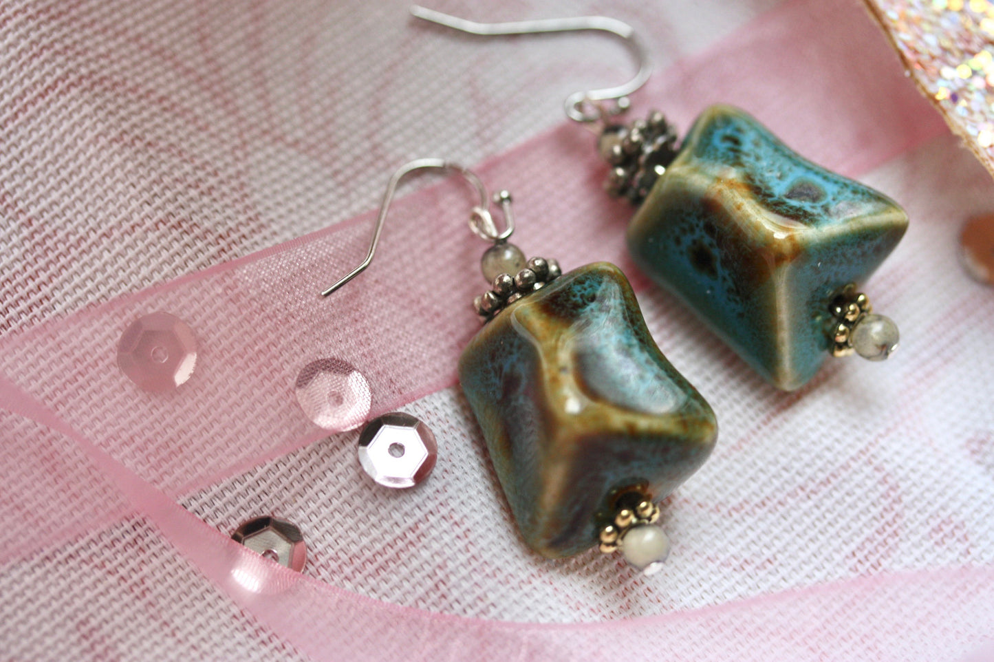Handmade dangle earrings made with uniquely shaped faux turquoise beads