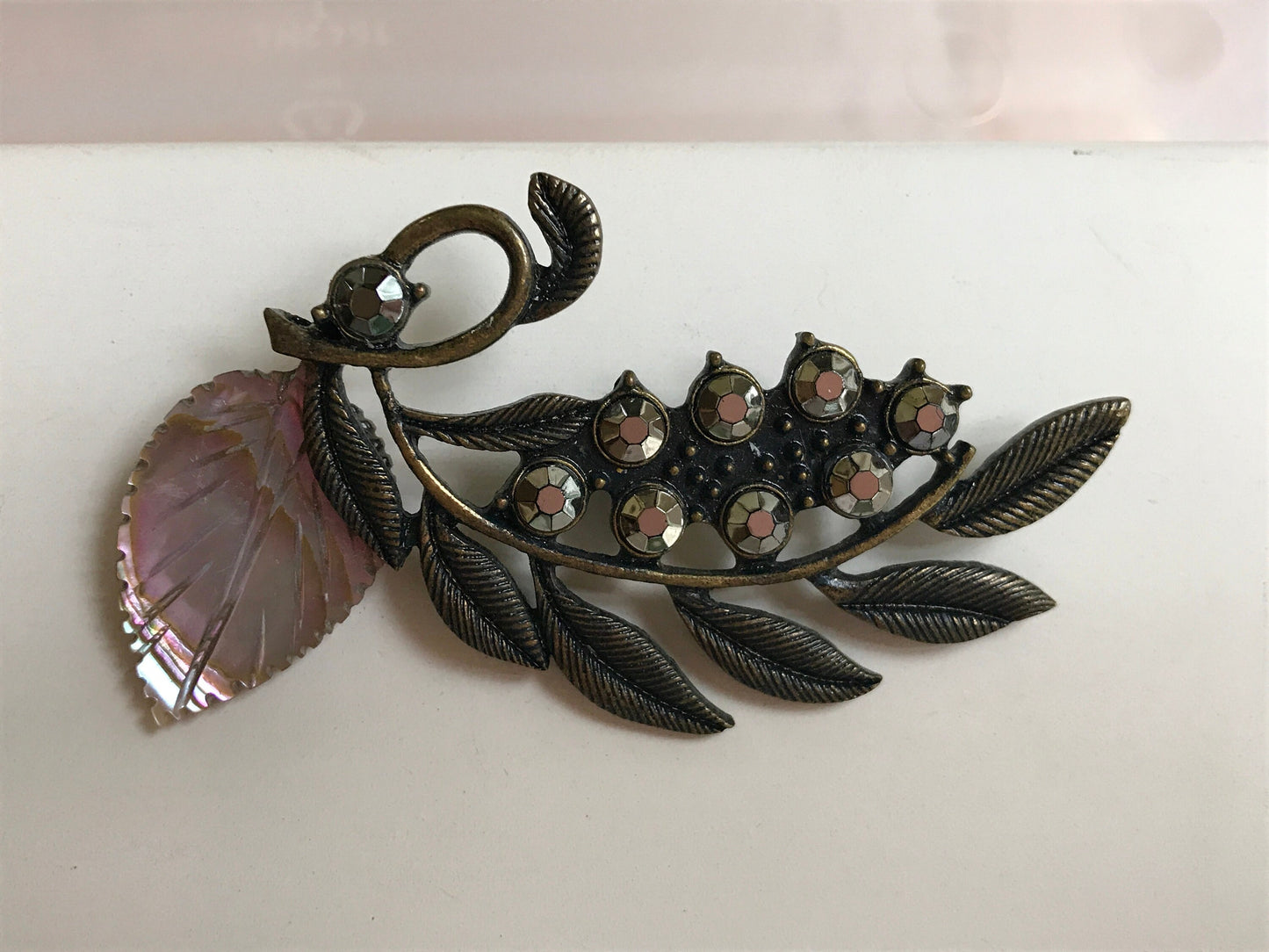 Stunning and unique vintage metal and rhinestone pin with abalone leaf