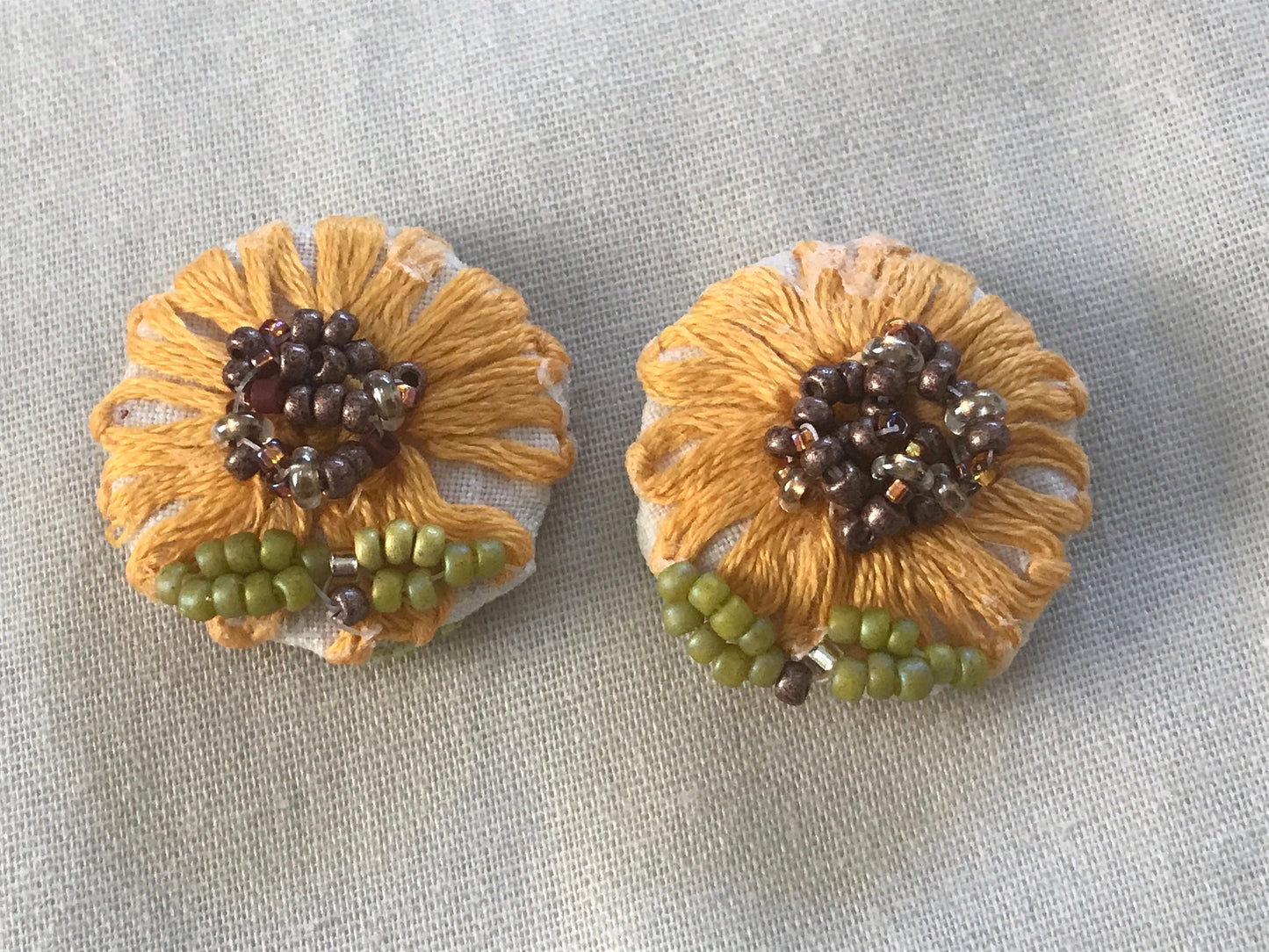 Upcycled sunflower earrings - embroidered flowers from vintage tablecloth surrounded by new, handmade beadwork - vintage and new materials