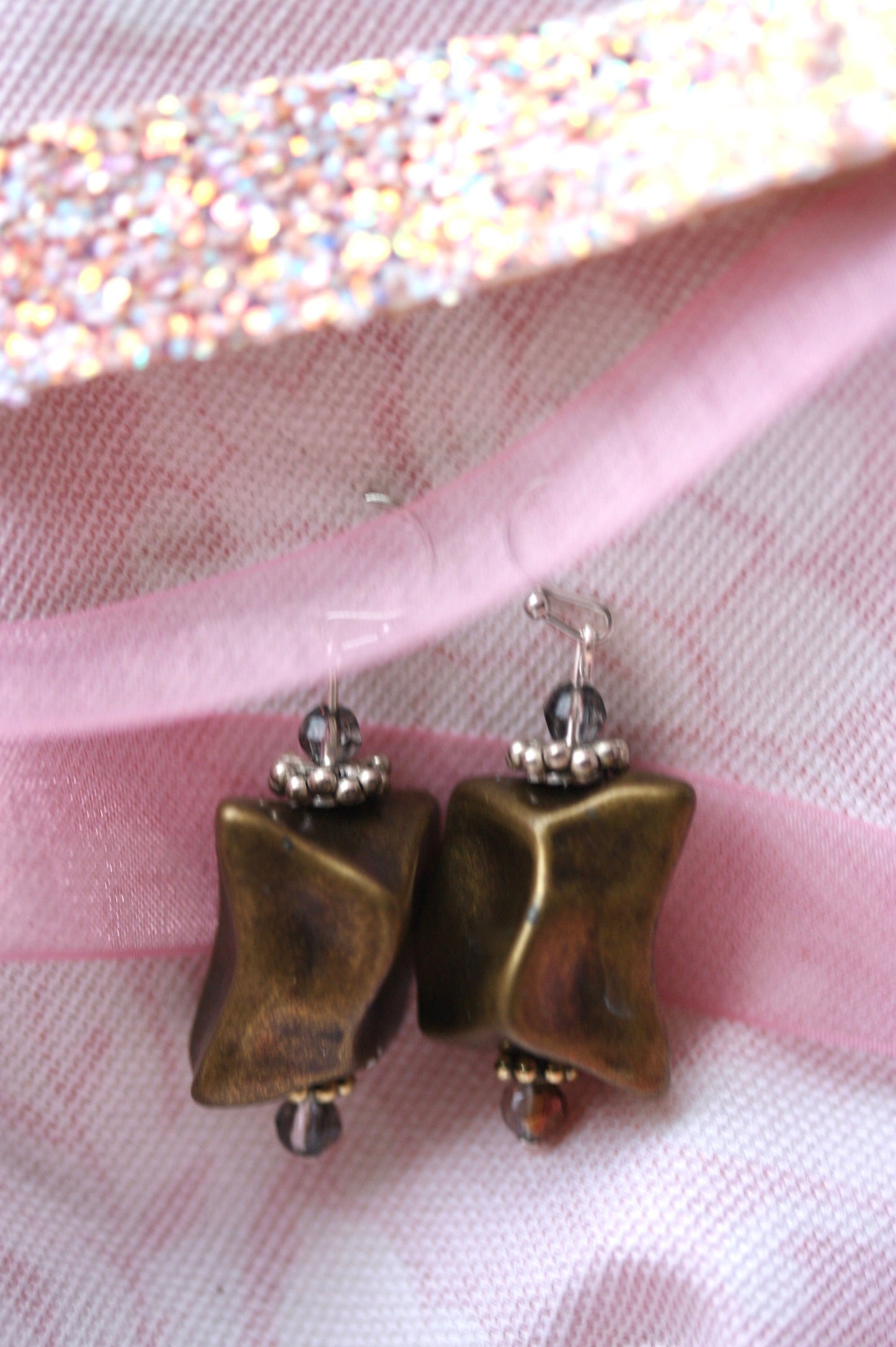 Handmade dangle earrings made with uniquely shaped faux stone beads