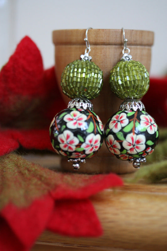 Green beaded bead and floral painted wood dangle earrings