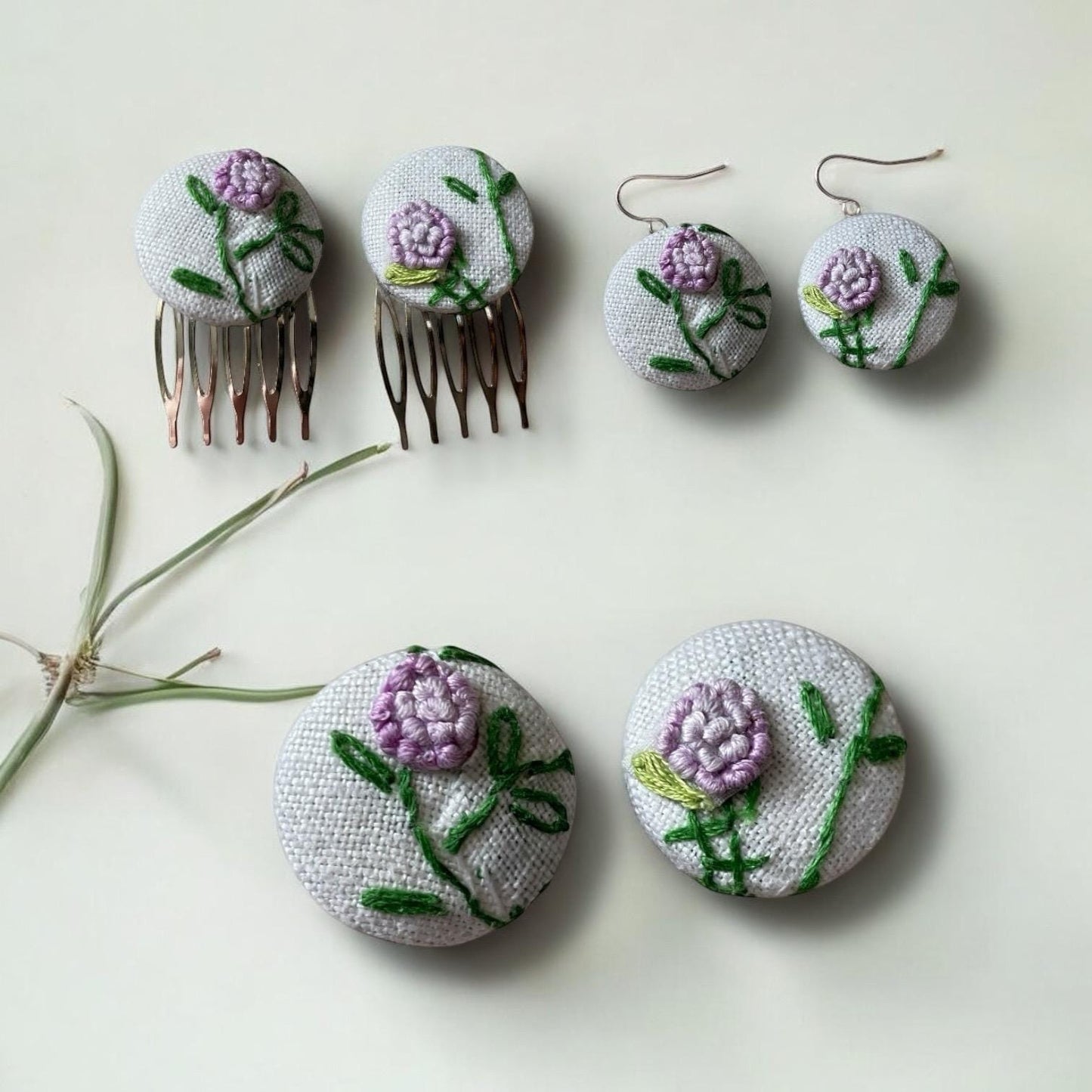 Choice of stud earrings, dangle earrings, hair combs, shanked buttons or pins all hand made from a vintage linen embroidered table runner