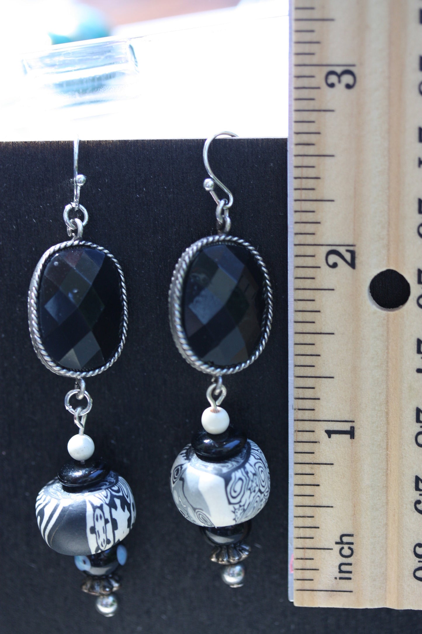 Black and white mixed media earrings made of upcycled polymer clay, combined with vintage black faux crystal, metal and glass spacer beads