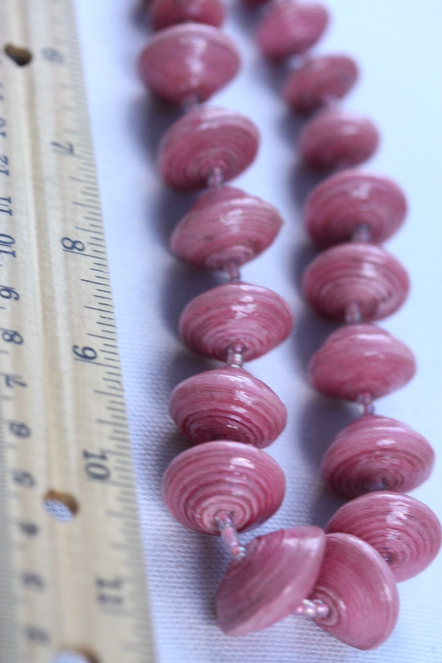 Long vintage various sized rolled paper light pink necklace
