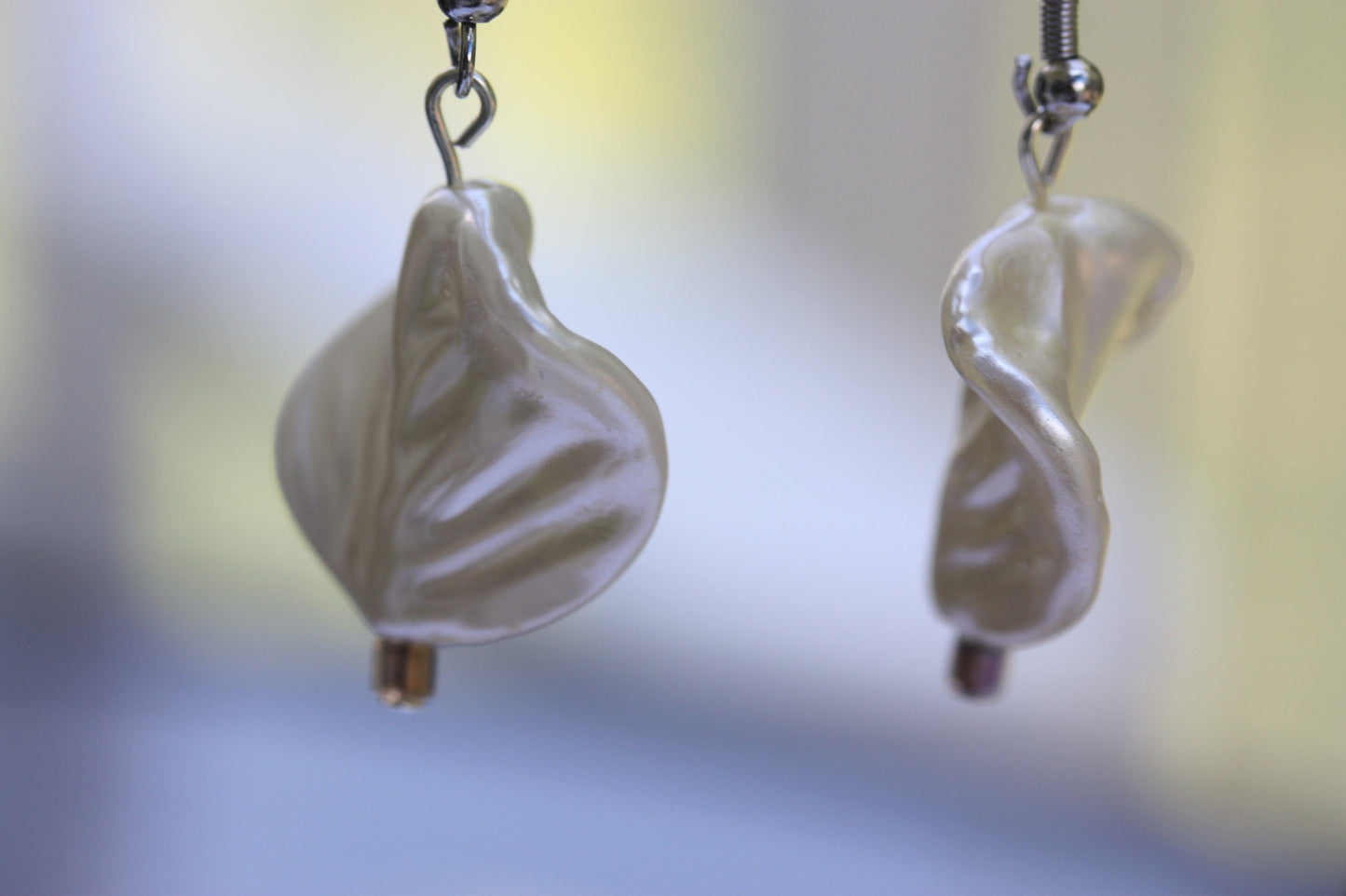 Pearlescent leaves dangle earrings trimmed with tiny sparkly seed beads