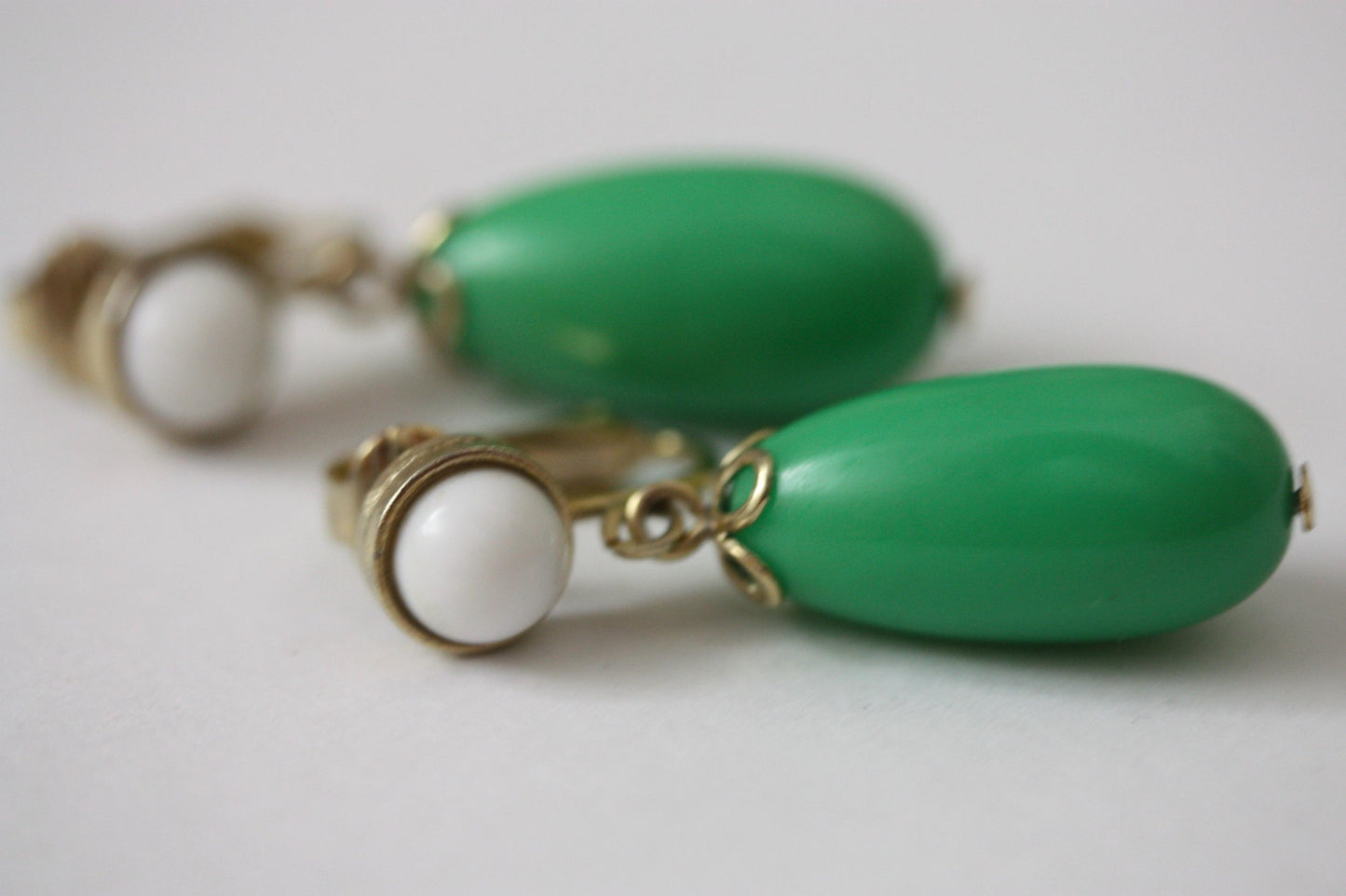 Green and white vintage Avon clip on dangle earrings