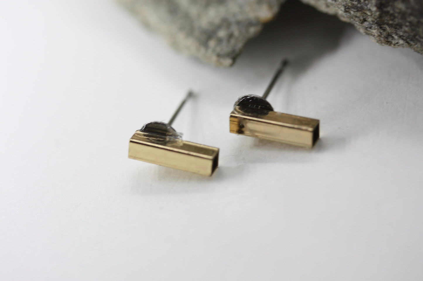 Tiny barely-there goldtone bar on silvertone circle minimalist stud earrings