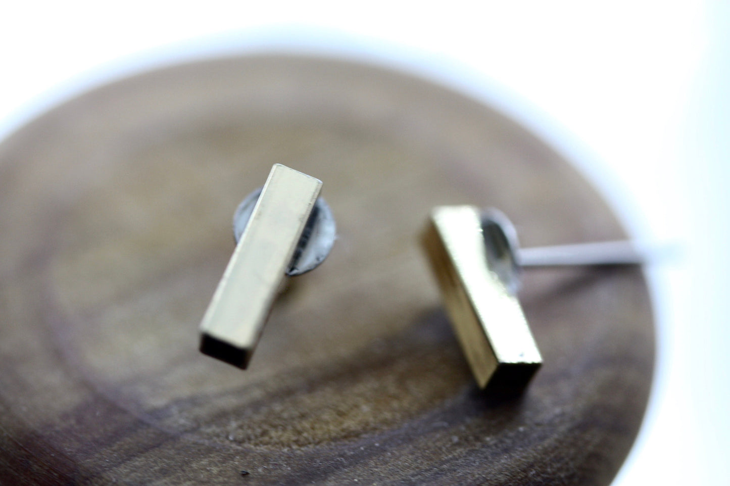 Tiny barely-there goldtone bar on silvertone circle minimalist stud earrings