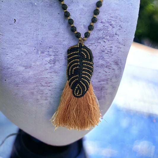 Stunning and unique hand beaded vintage artisan black and gold tassel necklace